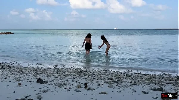 Busty stepmom and stepdaughter got golden showers instead of tanning on a public beach